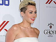 Miley Cyrus posing at the Maxim Hot 100 Party