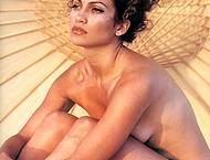 Jennifer Lopez posing sexy and without bra